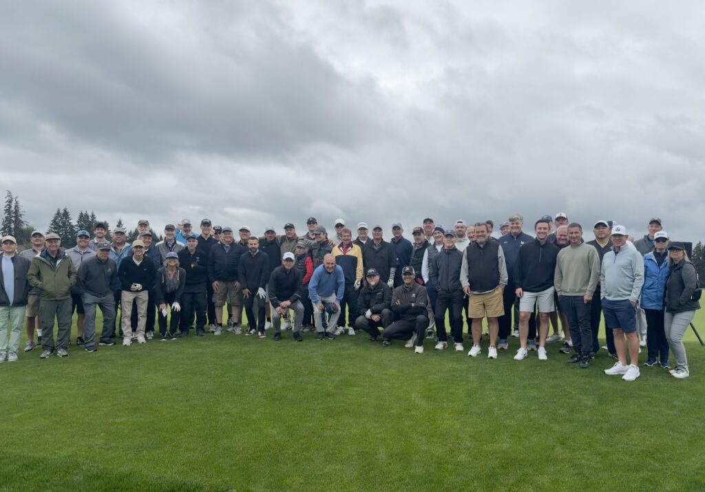 Inaugural Be Like Jeff | Live Heads Up Golf Tournament, group picture on green.